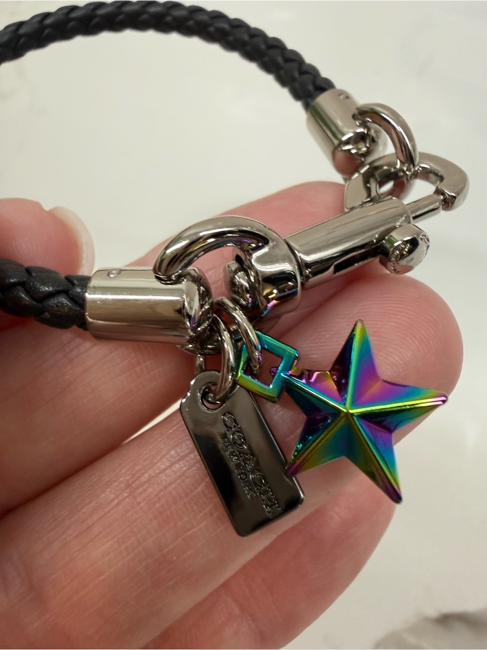Coach Black Braided Leather Bracelet with Iridescent Star Charm